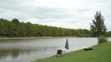 Angler chair and stuff left unattended at the lake side