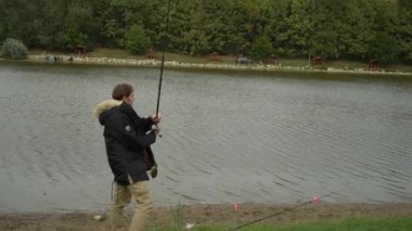 The moment of casting in with a fishing rod