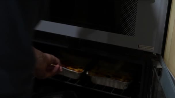 Taking Hot Lasagne Out Oven — Vídeo de Stock