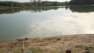 Fishing rod tipping off and angler running to catch it