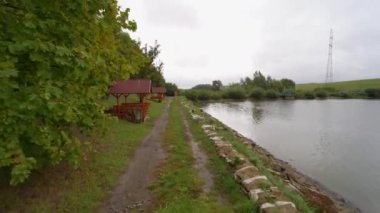 Walking towards the end of a lake and turning around