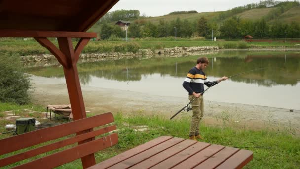 Angler Preparing Rods Fishing Lake — Stock video