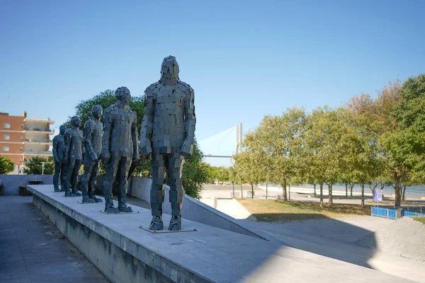 Row of iron statues of humans