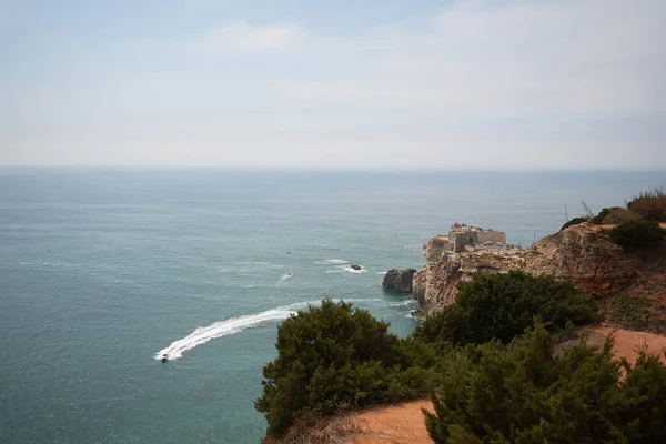 Overlooking the ocean with a boat passing