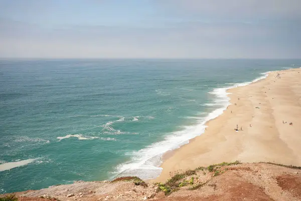 Looking over the blue ocean with big waves