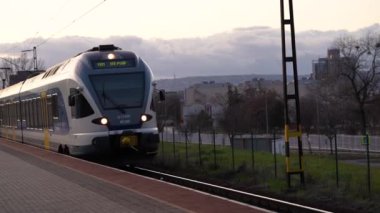 Train stopping at the station passengers getting on. High quality 4k footage