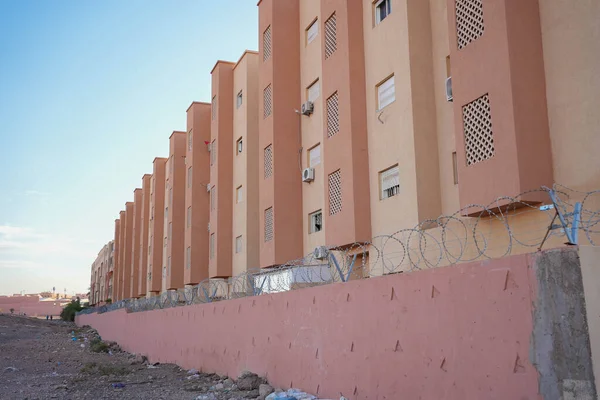 High security fence in front of apartments in Morocco Marrakesh. High quality image