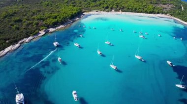 Aerial video of luxury super yacht marina and sailing boats. Modern water transport, summertime vacation, luxury lifestyle and wealth concept