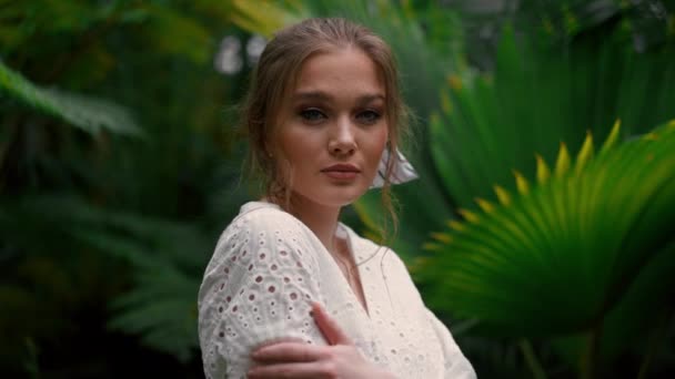 Romantic Young Woman Wearing White Dress Posing Camera Botanical Garden — Stock Video