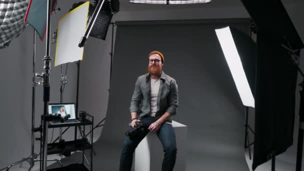 Positive Bearded Photographer Talking Camera Studio While Making Tutorial Black — Stock Video