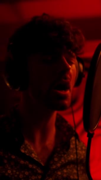 Singer Man Holding Hands Headphones While Recording Song Red Light — Vídeos de Stock