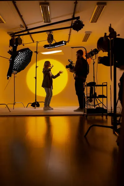 Videographer Capturing Footage Yellow Room Using Video Camera Showcasing His Royalty Free Stock Photos