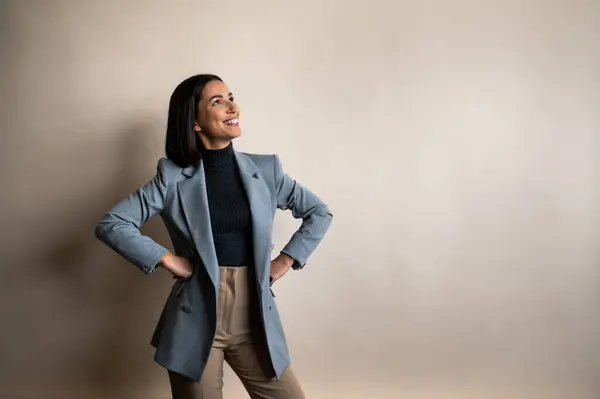 Woman Wearing Blue Blazer Brown Pants Stands Her Hands Her Stock Picture