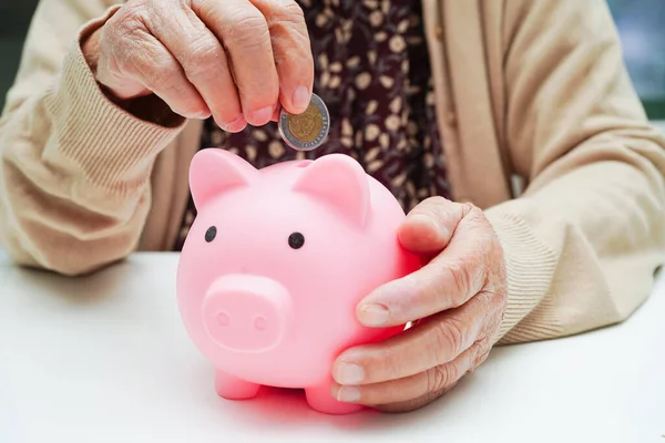 Retired Elderly Woman Putting Coins Money Piggy Bank Worry Monthly — Stockfoto