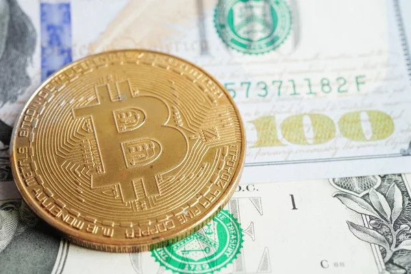 stock image Golden bitcoin on US dollar banknotes money for business and commercial, Digital currency, Virtual cryptocurrency, blockchain technology.