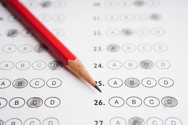 Answer sheets with pencil drawing fill to select choice, education concept.
