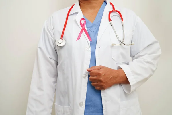 Asian woman doctor with pink ribbon, World Breast Cancer Day at October.