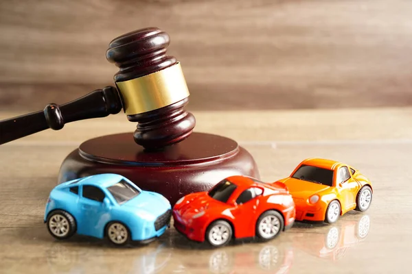 stock image Bangkok, Thailand March 15, 2023 Car accident lawsuit and insurance, Judge hammer with car model.