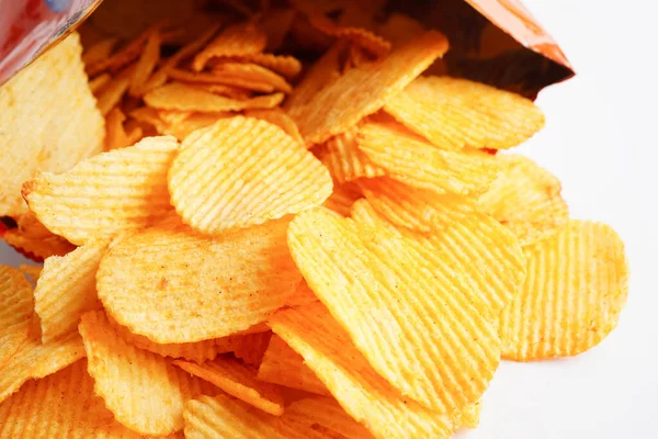 Potato chips in open bag, delicious BBQ seasoning spicy for crips, thin slice deep fried snack fast food.