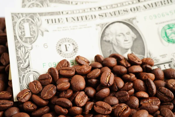 stock image US dollar banknotes on coffee beans, shopping online for export or import.