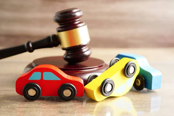stock image Bangkok, Thailand March 15, 2023 Car accident lawsuit and insurance, Judge hammer with car model.