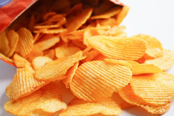 stock image Potato chips in open bag, delicious BBQ seasoning spicy for crips, thin slice deep fried snack fast food.