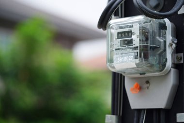 Bangkok, Thailand - May 15, 2022 Electric measuring power meter for energy cost at home and office.