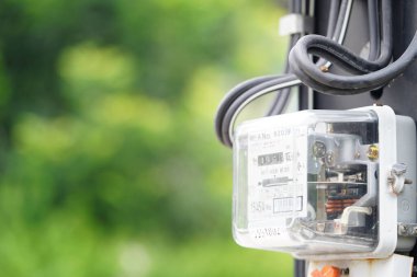 Bangkok, Thailand - May 15, 2022 Electric measuring power meter for energy cost at home and office.