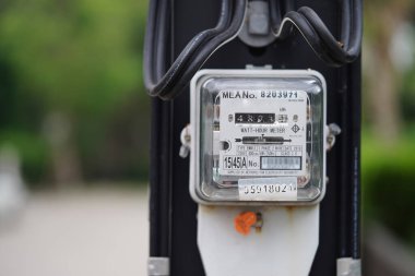 Bangkok, Thailand - May 15, 2022 Electric measuring power meter for energy cost at home and office.