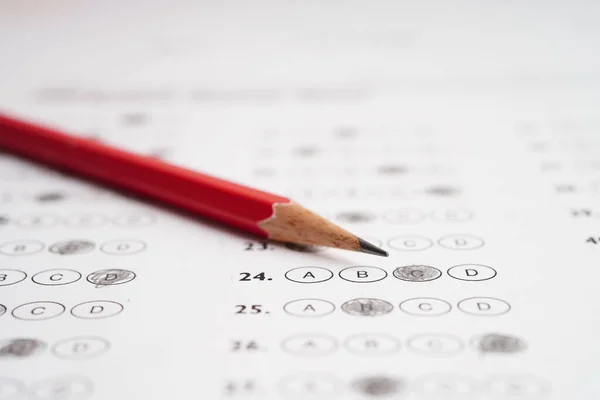 Answer sheets with pencil drawing fill to select choice, education concept.