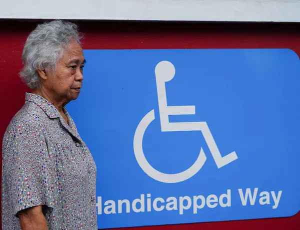 Asian elderly old woman patient with disability person symbol.