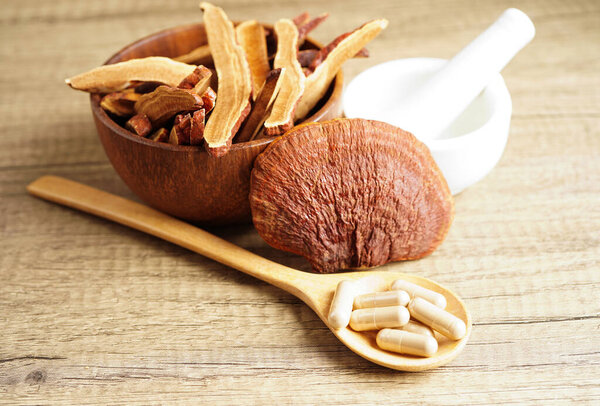 Lingzhi or Reishi mushroom with capsules, organic natural healthy food.