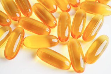 Fish oil or Cod liver oil gel in capsules with omega 3 vitamins, supplementary healthy food 