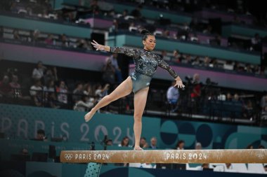 PARIS, FRANCE-July 28: Sunisa Lee  of team United States competes on the balance beam during the Artistic Gymnastics Women's Qualification at the the Olympic Games Paris 2024 at Bercy Arena on July 28 PARIS, FRANCE clipart