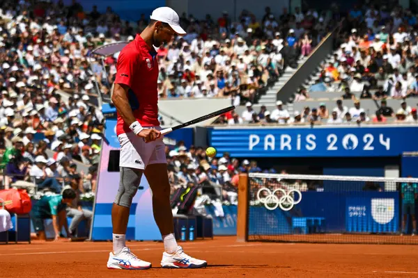 stock image PARIS, FRANCE-July 29:  Novak Djokovic of Team Serbia competes Rafael Nadal during during the Men's Singles second round tennis match on day three of the Olympic Games Paris 2024 at Roland Garros on July 29, 2024 in Paris, France.