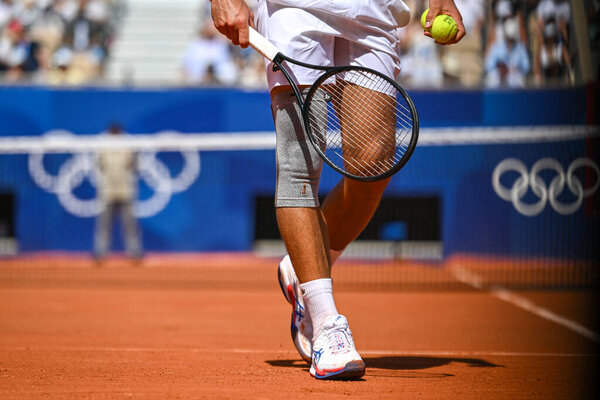 PARIS, FRANCE-July 29:  Novak Djokovic of Team Serbia competes Rafael Nadal during during the Men's Singles second round tennis match on day three of the Olympic Games Paris 2024 at Roland Garros on July 29, 2024 in Paris, France.