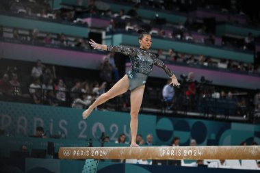 PARIS, FRANCE-28 July 2024: Sunisa Lee of USA competes on the balance beam during the Artistic Gymnastics Women's Qualification at the the Olympic Games Paris 2024 at Bercy Arena clipart