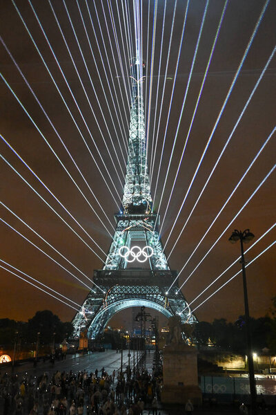 PARIS, FRANCE-26 July 2024: Lights illuminate the Eiffel Tower during the Opening Ceremony of the Olympic Games Paris 2024