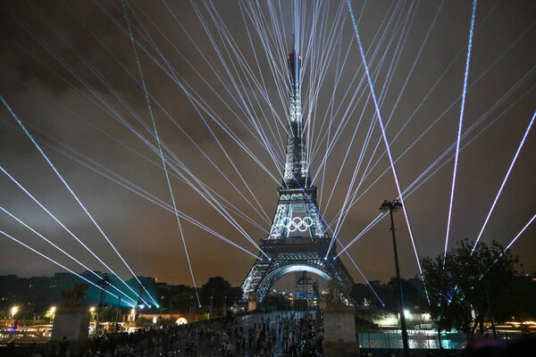 PARIS, FRANCE-26 July 2024: Lights illuminate the Eiffel Tower during the Opening Ceremony of the Olympic Games Paris 2024