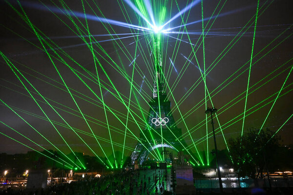 PARIS, FRANCE-26 July 2024: Lights illuminate the Eiffel Tower during the Opening Ceremony of the Olympic Games Paris 2024