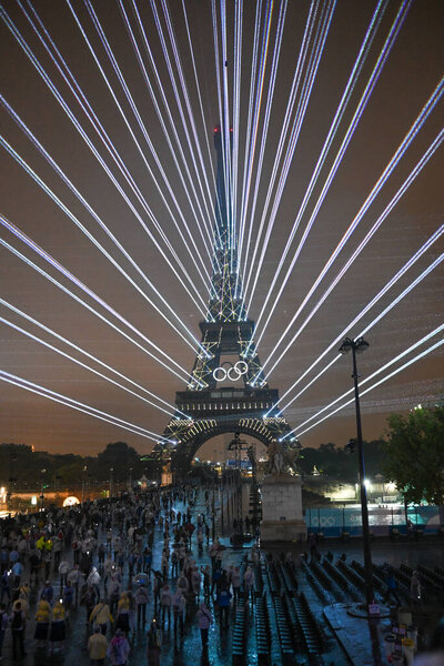PARIS, FRANCE-26 July 2024: Lights illuminate the Eiffel Tower during the Opening Ceremony of the Olympic Games Paris 2024