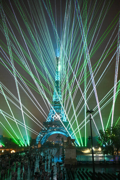 PARIS, FRANCE-26 July 2024: Lights illuminate the Eiffel Tower during the Opening Ceremony of the Olympic Games Paris 2024