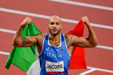 TOKYO, JAPAN- 01 AUGUST 2020: Lamont Marcell Jacobs of Team Italy celebrates after winning the Men's 100m Final on day nine of the Tokyo 2020 Olympic Games clipart