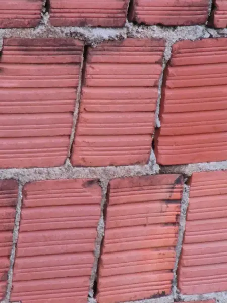 Desen tasarımlı eski kırmızı tuğla duvar arkaplanı.