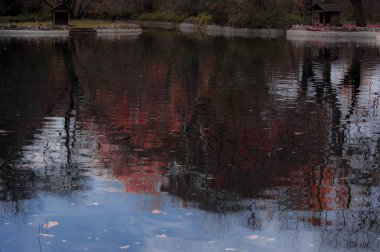pond with silk water in the fall in the capricho park of the city of madrid urban photography