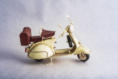 photography of a steel toy motorcycle in a vintage collection for decoration
