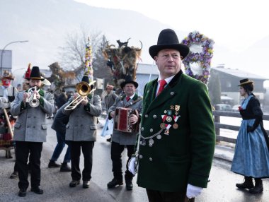 AUSTRIA, GASTEIN - January 1, 2023: Commander and musicians in the Perchtenlauf procession in the Austrian Gastein Valley. High quality photo