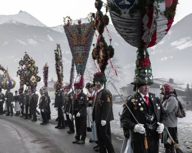 AUSTRIA, GASTEIN - January 1, 2023: Perchten on a country road in the Austrian Gastein Valley. High quality photo