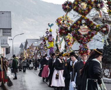AUSTRIA, GASTEIN - January 1, 2023: Street dance in the Perchtenlauf procession in the Austrian Gastein Valley. High quality photo
