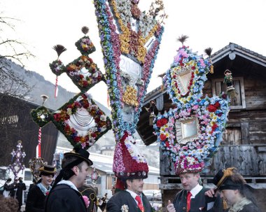 AUSTRIA, GASTEIN - January 1, 2023: hat wearers in the Perchtenlauf procession in the Austrian Gastein Valley. High quality photo